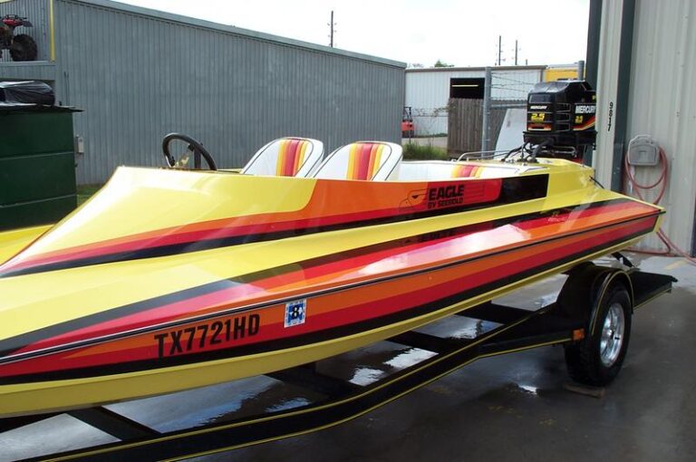 A picture of a painted boat after being worked on by West TX Auto Paint and Boat team