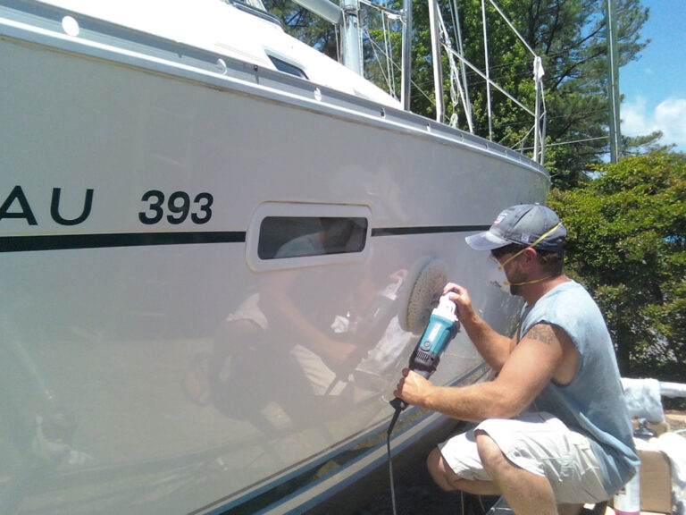 A picture of a boat being painted by West TX Auto Paint and Boat team