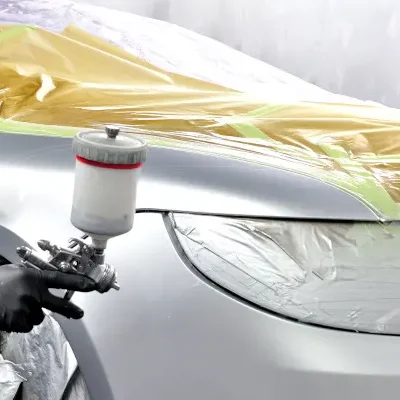 A picture of a car being painted by West TX Auto Paint and Boat team